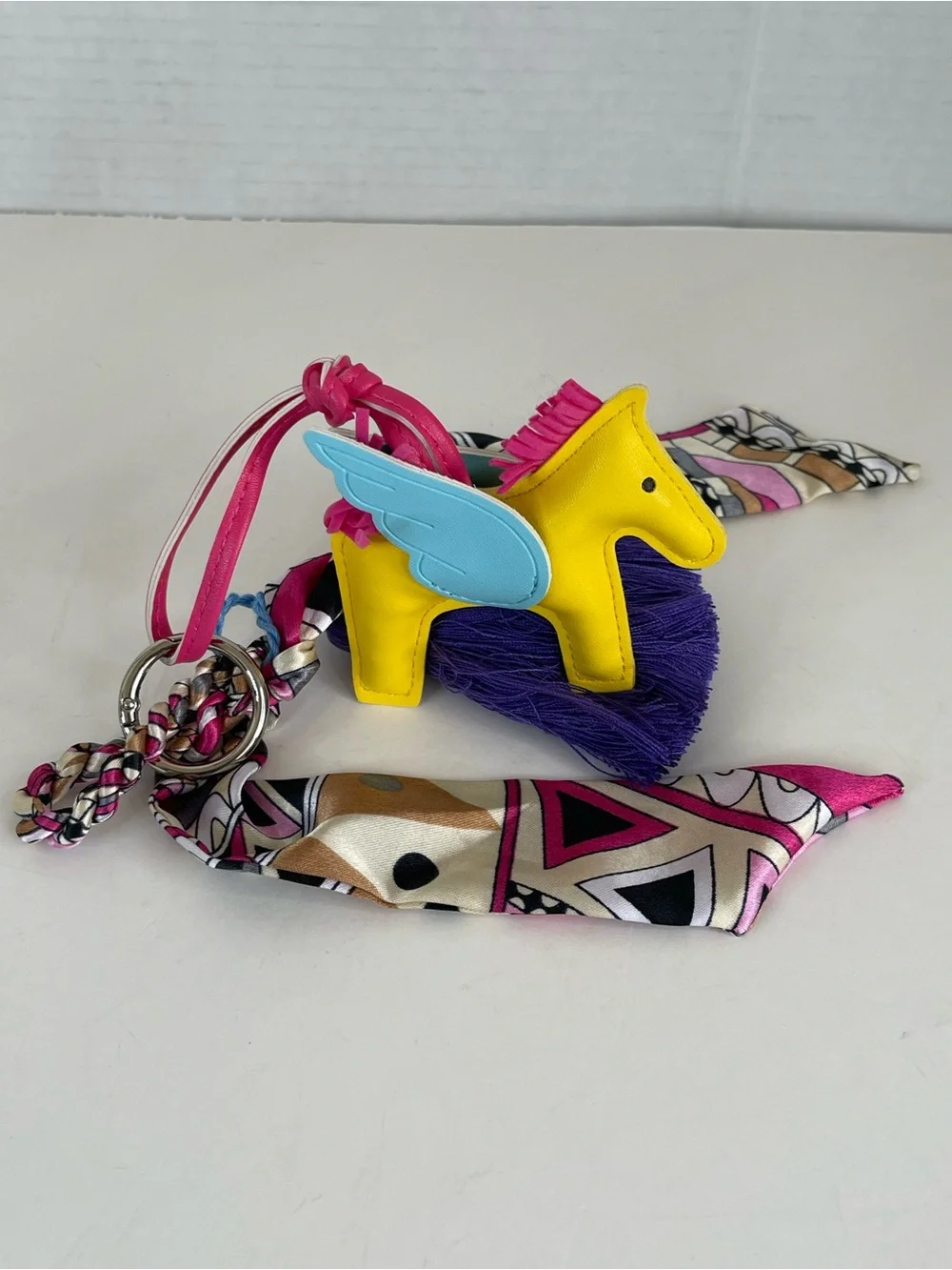 Bright Yellow Pony Bag Charm with Blue Wings and Purple Tassel